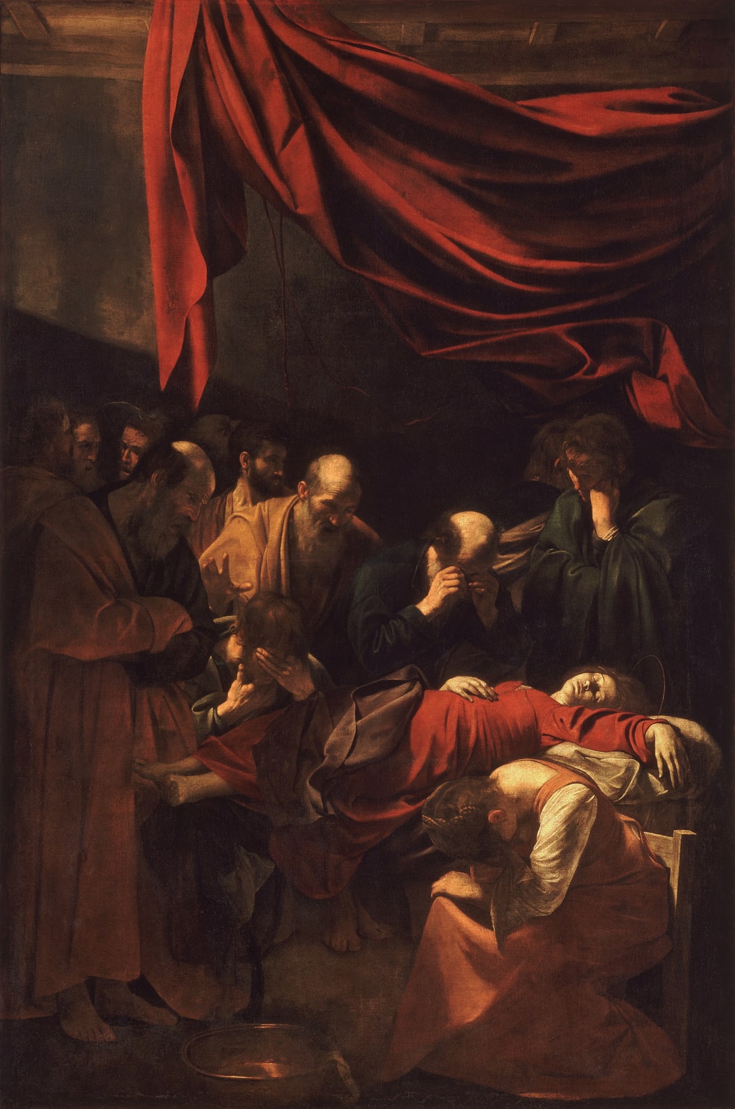 Death of the Virgin by Caravaggio, with Mary lying beneath a red curtain as mourners gather in a dark room