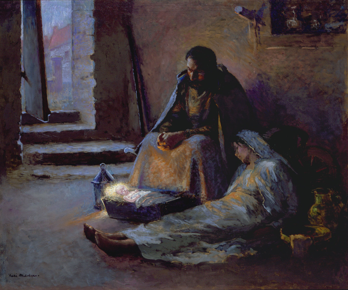 Joseph sits beside Mary, who rests on the floor near the glowing infant Jesus in a low manger in a dim room.
