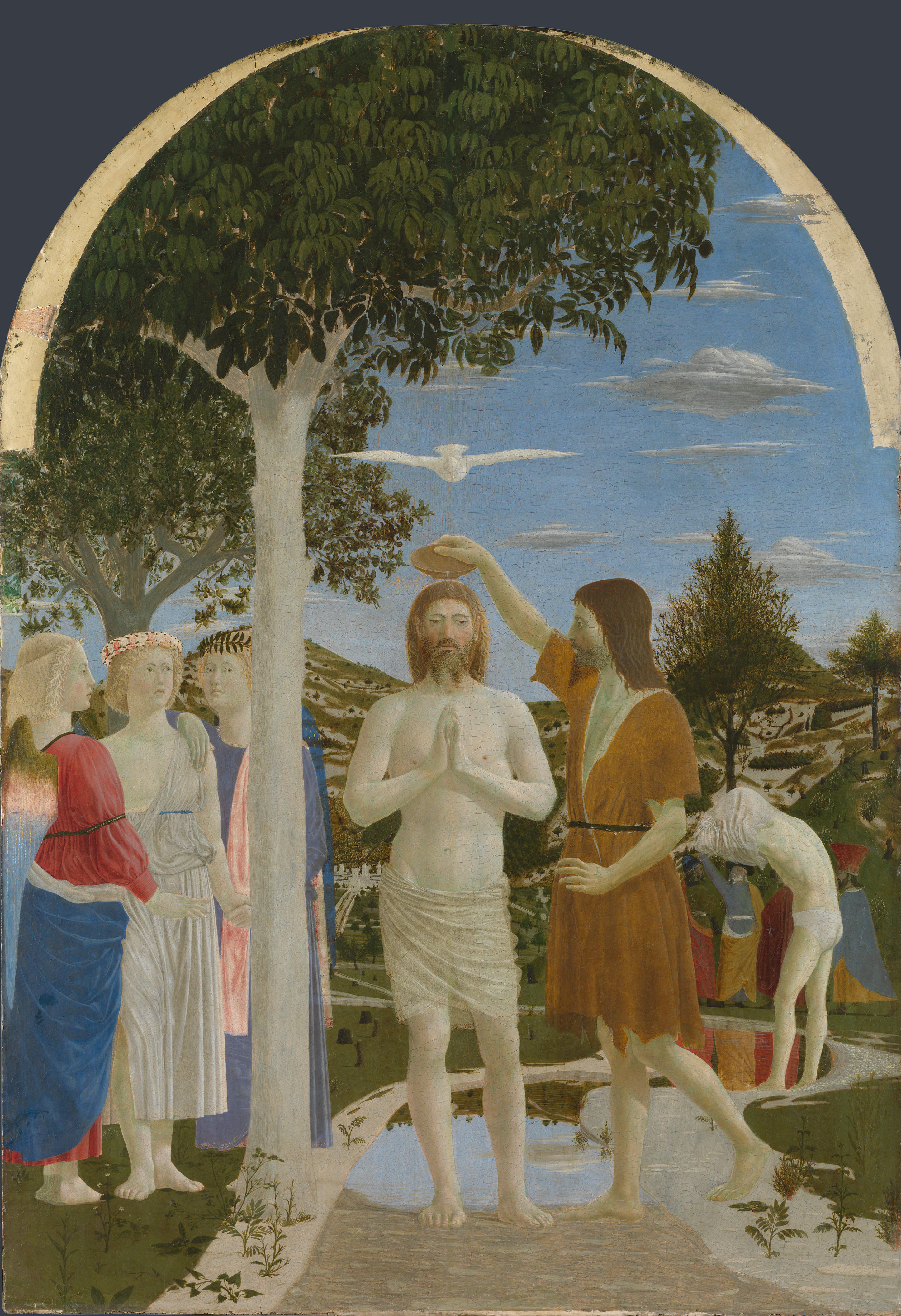 Christ stands in a river with his hands joined as John pours water over his head; three angels stand beneath a tree at the left.