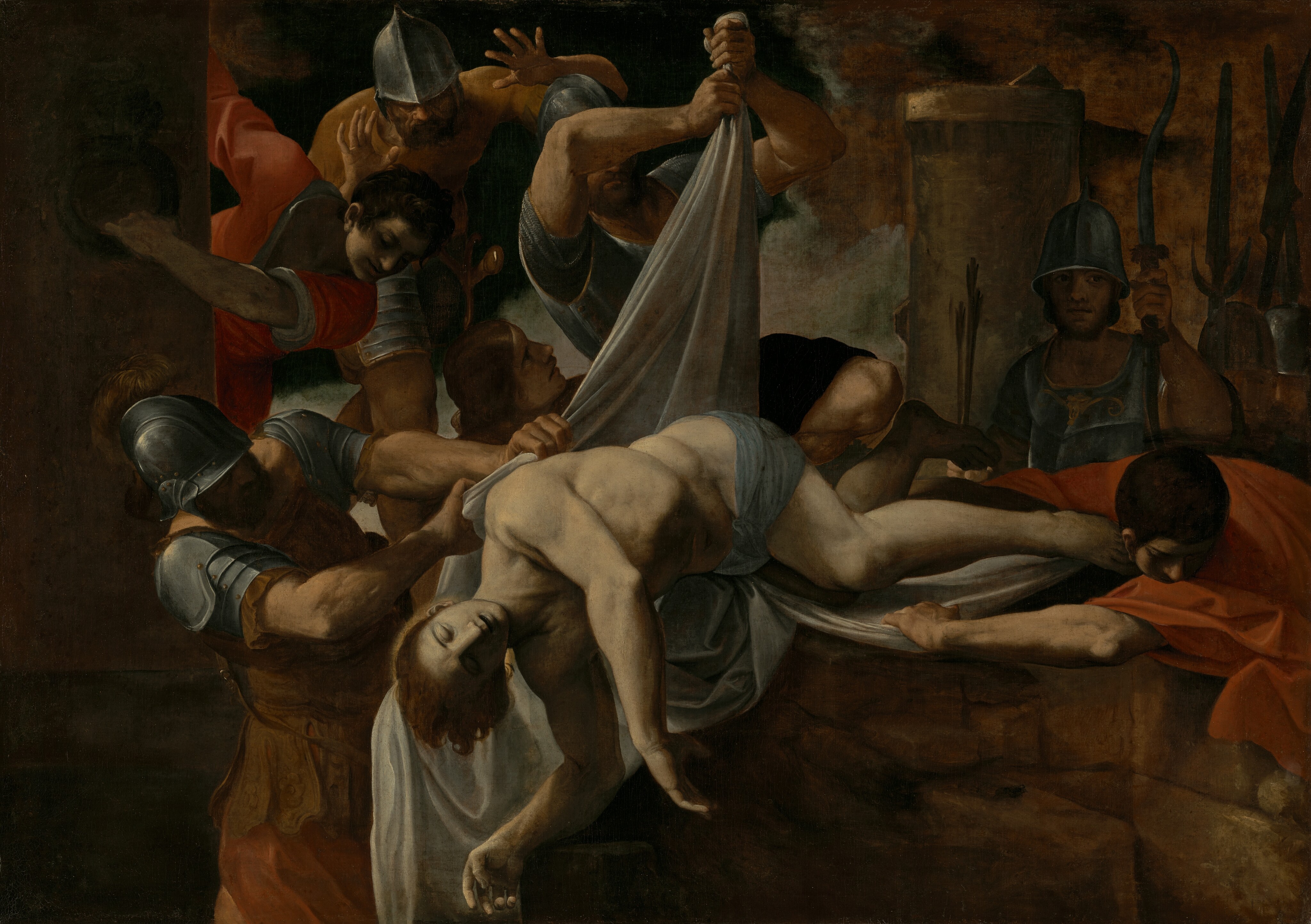 Men lift and push Sebastian’s limp body over a stone edge toward the dark opening of the Cloaca Maxima.