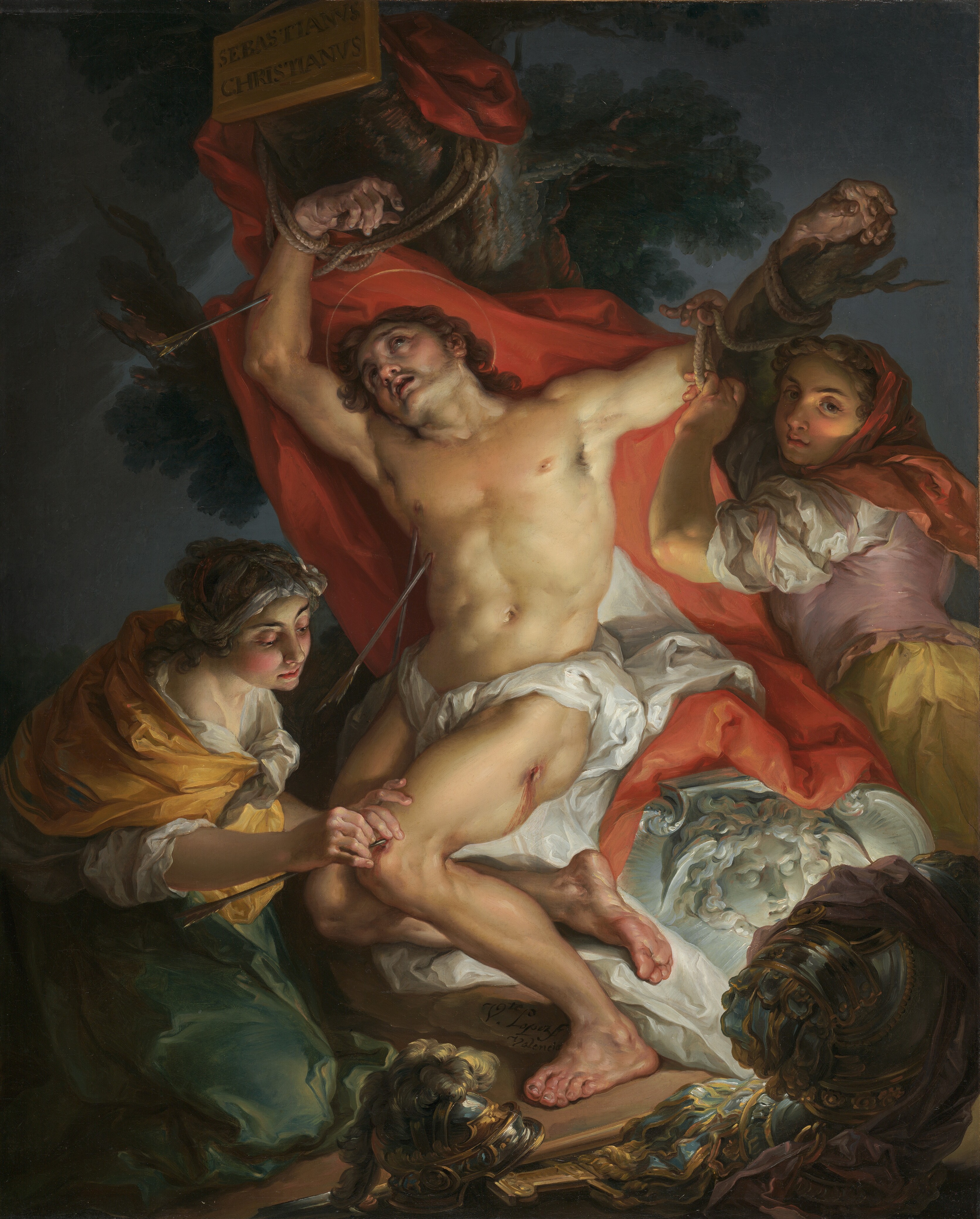 Two women tend Sebastian, whose arms remain bound to a tree, with red cloth behind his body and ornate armor at his feet.